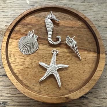 seaside themed jewellery made from silver clay on a jewellery course